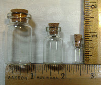 3009. Small Glass Bottles in Three Sizes.