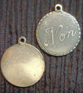 3913. French "Non" Charms.