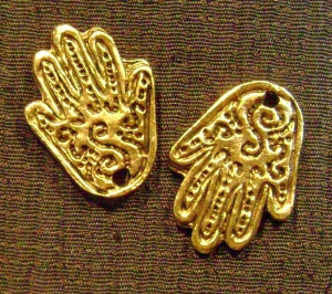 gold decorated hand charm
