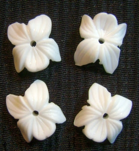 white plastic flower beads